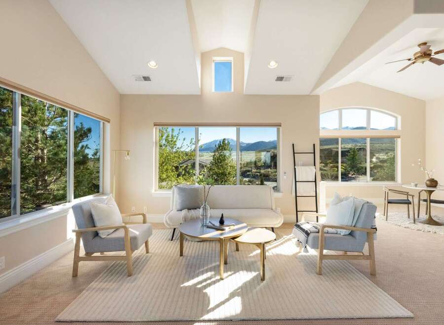 This stunning living room boasts an open and airy design, perfect for relaxation and entertaining.