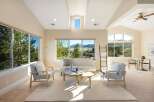 This stunning living room boasts an open and airy design, perfect for relaxation and entertaining.