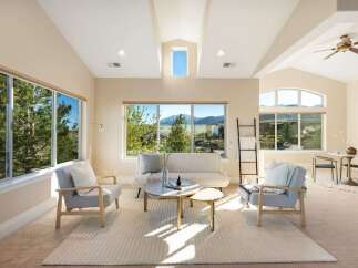 This stunning living room boasts an open and airy design, perfect for relaxation and entertaining.