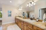 This luxurious bathroom features a double vanity with ample storage and a stunning countertop.