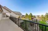 Enjoy breathtaking views from this stunning property! This home features a spacious balcony overlooking a beautifully landscaped yard and the surrounding neighborhood.