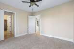 Step into this inviting bedroom, featuring neutral tones and ample natural light.