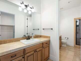 Step into luxury with this beautifully designed bathroom! Featuring a sleek vanity, ample storage, and elegant fixtures, this space is perfect for relaxation and rejuvenation.