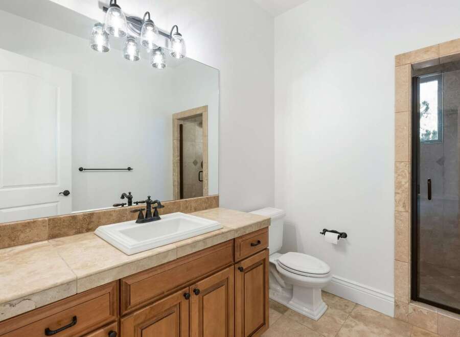 This stunning bathroom boasts a modern design with a touch of elegance.