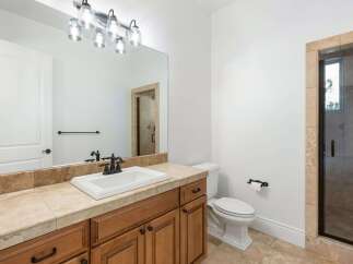 This stunning bathroom boasts a modern design with a touch of elegance.
