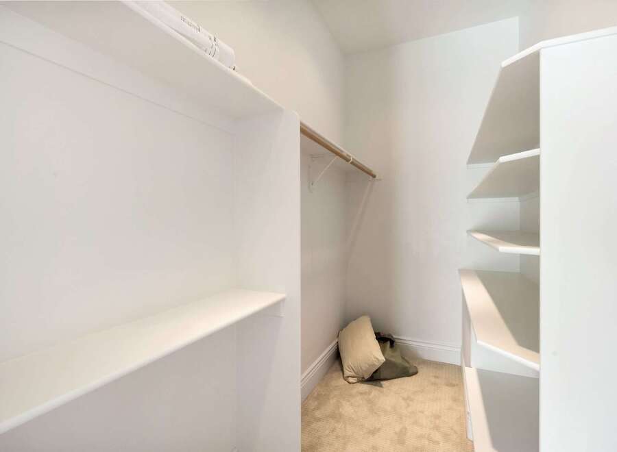 Discover the perfect blend of functionality and style with this walk-in closet.