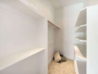 Discover the perfect blend of functionality and style with this walk-in closet.
