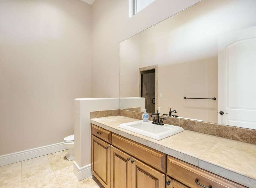 This stunning bathroom boasts a spacious layout and elegant design.