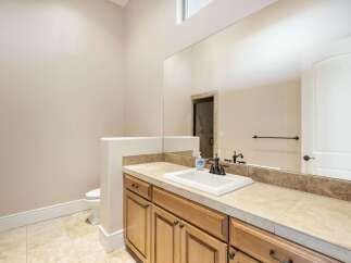 This stunning bathroom boasts a spacious layout and elegant design.