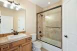 This beautiful bathroom features a modern design with a spacious vanity and a sleek shower.