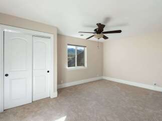 This inviting bedroom features a neutral color palette, creating a serene and relaxing atmosphere.