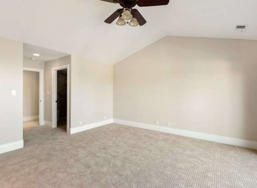Step into this spacious and inviting bedroom, perfect for relaxation and comfort.