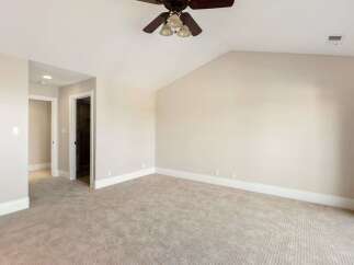 Step into this spacious and inviting bedroom, perfect for relaxation and comfort.