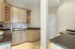 This stunning kitchen boasts elegant cabinetry, perfect for storage and organization.