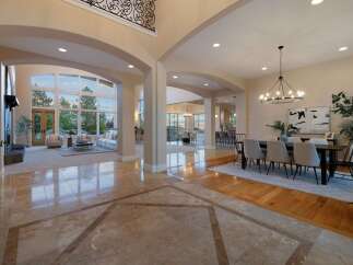 Step into luxury with this stunning property, showcasing an open-concept design and exquisite architectural details.