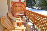 Enjoy the charm of this unique property with its ski lift-inspired seating and rustic wooden accents.