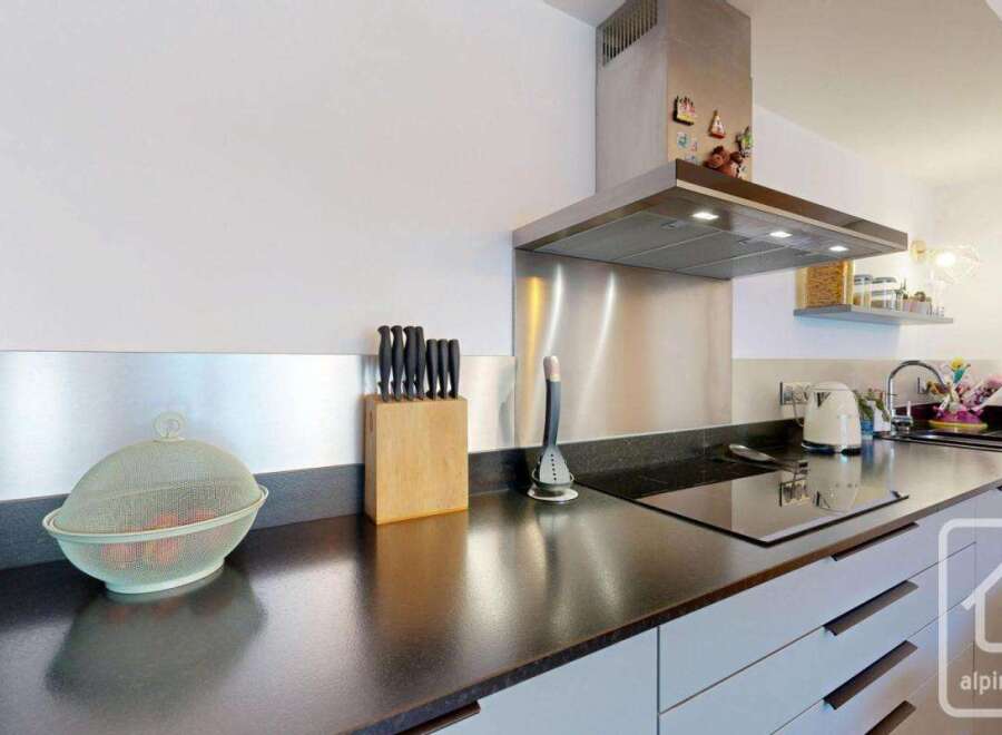 This modern kitchen boasts sleek stainless steel appliances and a stylish design.