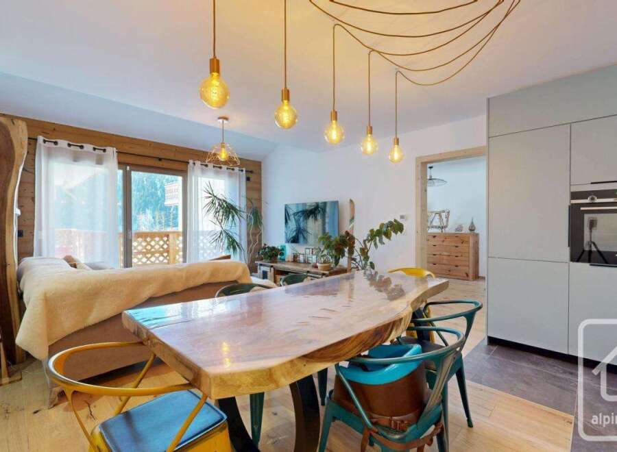 Experience luxury living in this stunning property, featuring a modern kitchen and a spacious dining area perfect for entertaining.