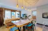 Experience luxury living in this stunning property, featuring a modern kitchen and a spacious dining area perfect for entertaining.