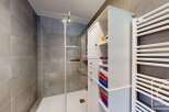 Step into a modern bathroom oasis! This stunning space features a sleek glass shower, perfect for a refreshing start to your day.