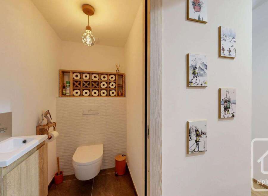 Discover this charming property featuring a stylish bathroom with modern fixtures and a unique design.
