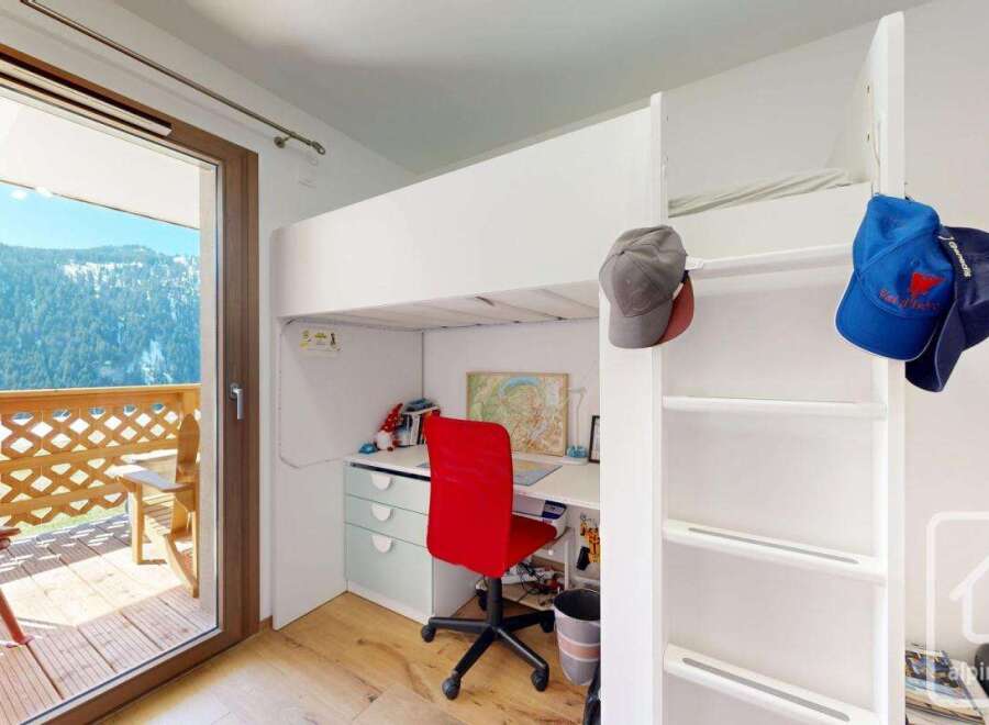 Discover this charming property featuring a cozy loft bed, perfect for maximizing space.