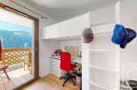 Discover this charming property featuring a cozy loft bed, perfect for maximizing space.