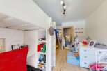Discover this charming children's room, perfect for imaginative play and comfortable living.