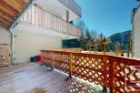 Enjoy stunning mountain views from this charming property featuring a spacious wooden deck and balcony.
