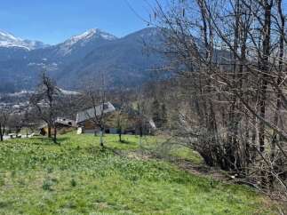Discover your dream home nestled in the heart of nature! This stunning property boasts breathtaking mountain views and a serene, green landscape.