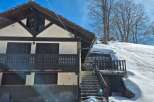 Discover the charm of this unique mountain chalet, nestled in a picturesque snowy landscape.