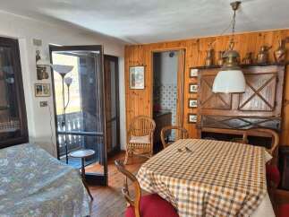 Step into this charming property and discover a cozy dining area, perfect for intimate gatherings.