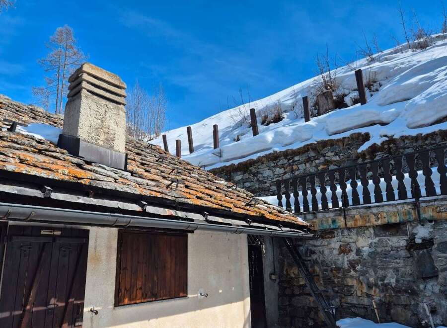 Discover the charm of this unique property nestled in a picturesque mountain setting.