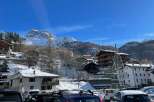 Discover the charm of mountain living in this picturesque village nestled amidst snow-capped peaks.