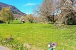 Discover a picturesque property nestled in a serene landscape, perfect for those seeking tranquility.