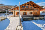 This stunning chalet-style home offers a perfect blend of rustic charm and modern comfort.