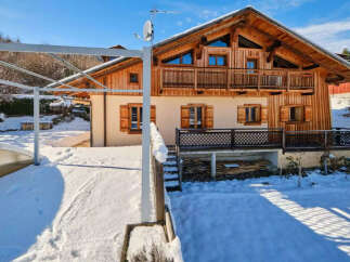This stunning chalet-style home offers a perfect blend of rustic charm and modern comfort.