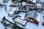 Discover a charming mountain retreat nestled in a snowy landscape.