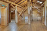 This stunning property boasts a unique architectural design with exposed wooden beams and a warm, inviting atmosphere.