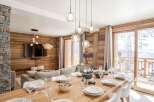 Experience luxury living in this stunning property, featuring a spacious dining area perfect for entertaining.