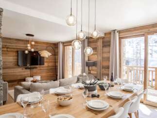 Experience luxury living in this stunning property, featuring a spacious dining area perfect for entertaining.