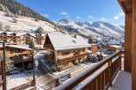 Experience the charm of a winter wonderland with this stunning property nestled in a snowy mountain village.
