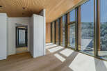 Experience luxury living in this stunning property, featuring a modern design with exquisite wooden accents.