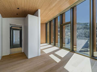 Experience luxury living in this stunning property, featuring a modern design with exquisite wooden accents.