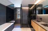 This modern bathroom boasts sleek design and luxurious features.