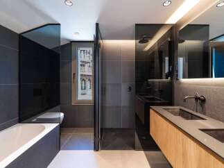 This modern bathroom boasts sleek design and luxurious features.