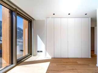 Experience the epitome of modern living in this stunning property, boasting expansive windows that frame breathtaking mountain views.