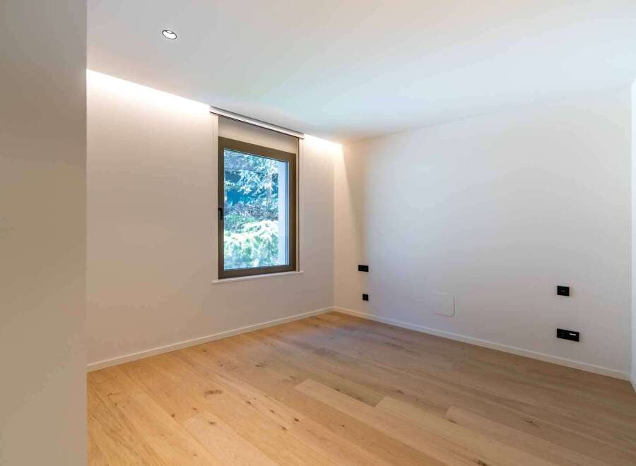 This modern room features a minimalist design with clean lines and a neutral color palette.