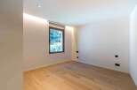 This modern room features a minimalist design with clean lines and a neutral color palette.