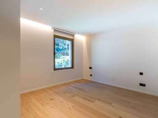 This modern room features a minimalist design with clean lines and a neutral color palette.